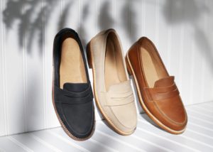 loafers-leaning-along-white-wall