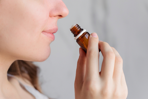 Aromatherapy:,A,Girl,With,Beautiful,Skin,Holds,A,Bottle,Of