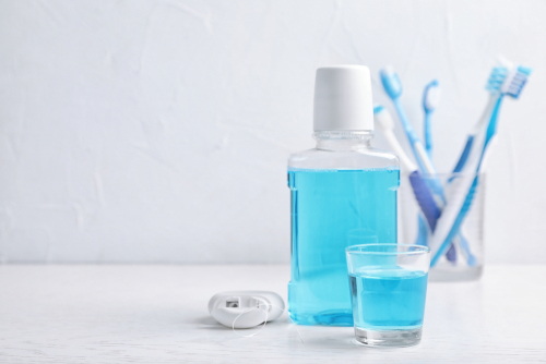 Oral,Care,Products,And,Space,For,Text,On,Light,Background.