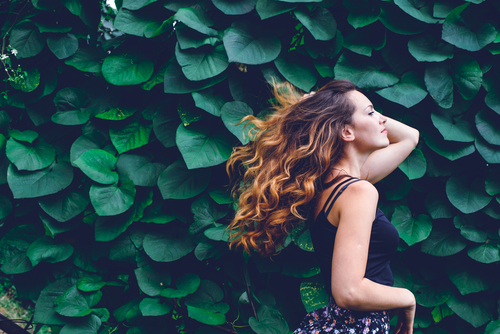 Young,Woman,,Against,Background,Of,Summer,Green,Park,,Green,Leaves.