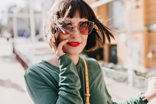 Portrait,Of,Refined,European,Girl,Posing,In,Windy,Spring,Day.