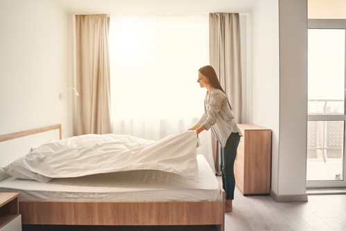 Fresh,Bedclothes.,Pretty,Female,Person,Keeping,Smile,On,Her,Face