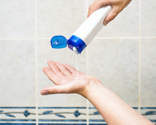 Man,Is,Pouring,Shampoo,On,His,Hand,,Shower,Gel,On