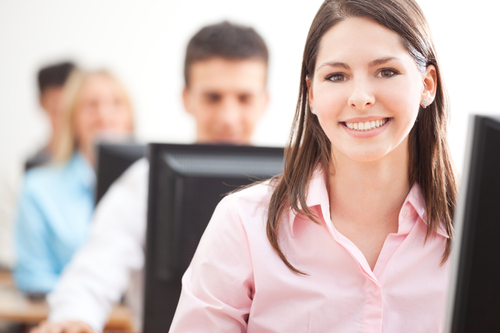 Smiling,Student,Using,Computer