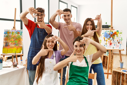 Group,Of,Five,Hispanic,Artists,At,Art,Studio,Smiling,Making