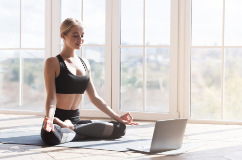 Sport,Application,,Website.,Cheerful,Young,Woman,Practicing,Yoga,At,Home,