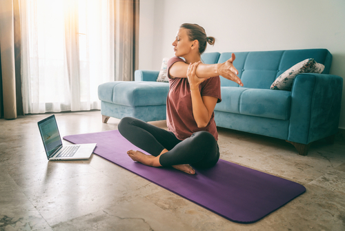 Attractive,Young,Woman,Doing,Yoga,Stretching,Yoga,Online,At,Home.