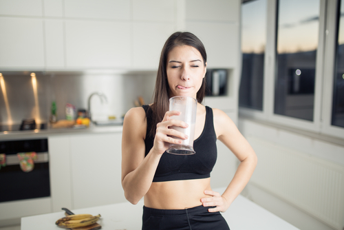 Woman,In,Sportswear,Drinking,Sweet,Banana,Chocolate,Protein,Powder,Milkshake