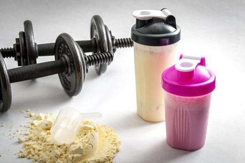 Fitness,And,Workout,Concept,With,Dumbbells,,Protein,Shakers,And,A