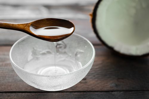 Coconut,Oil,In,Spoon,For,Massage,cold,Pressed,Pure,Coconut,Oil