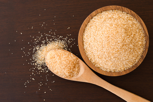 Brown,Sugar,In,Wooden,Bowl,And,Spoon,Isolated,On,Wooden