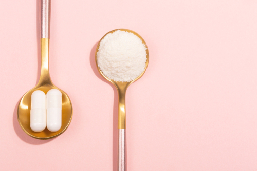 Collagen,Powder,And,Pills,On,Pink,Background.,Extra,Protein,Intake.