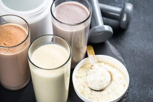 Protein,Cocktails,On,Black.,Vanilla,,Berry,And,Chocolate,Protein,Shakes.