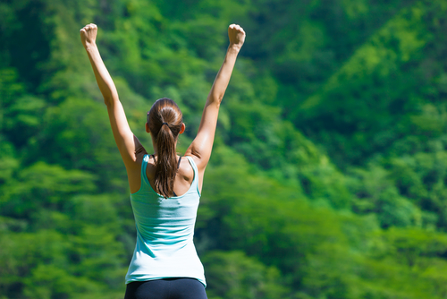 Happy,Fit,Girl,With,Her,Arms,In,The,Air,Celebrating.