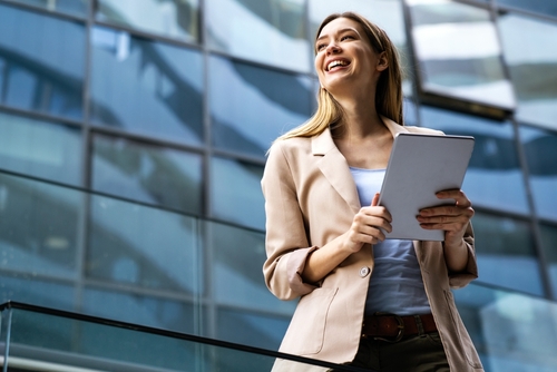 Portrait,Of,A,Successful,Business,Woman,Using,Digital,Tablet,In