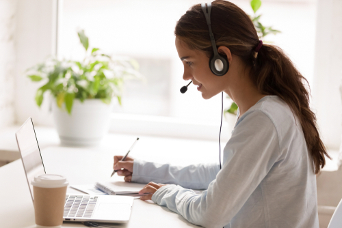 Side,View,Concentrated,Millennial,Mixed,Race,Woman,Wearing,Headset,With