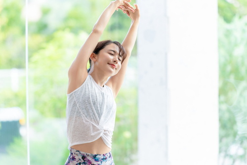 Young,Asian,Woman,Doing,Stretch.,Health,Care.,Body,Care.