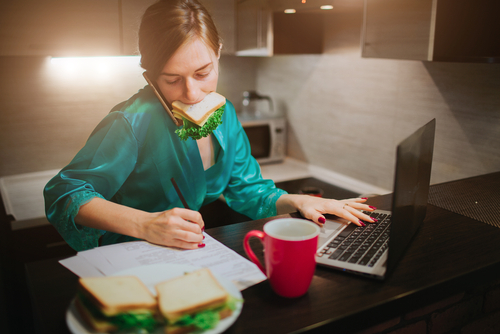 Busy,Woman,Eating,,Drinking,Coffee,,Talking,On,The,Phone,,Working