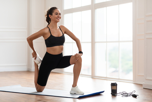Warming,Up,Before,Workout.,Smiling,Sporty,Woman,Training,At,Home