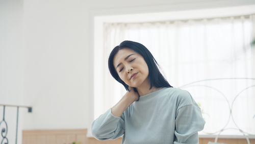 Tired,Middle,Aged,Woman.,Stiff,Shoulder.