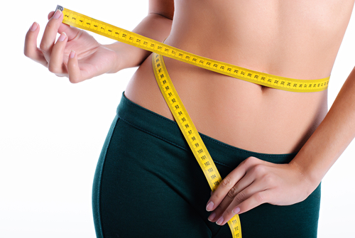 Hands,Measuring,Waist,With,A,Tape.,Fit,And,Healthy,Woman