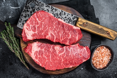 Marbled,Beef,Denver,Raw,Meat,Steak,With,Herbs.,Black,Background.